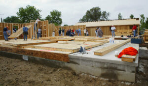 Builders building a house