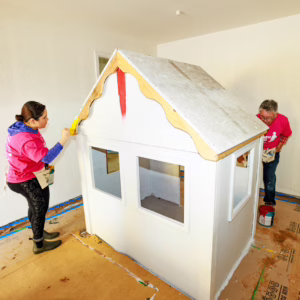 Volunteers Painting Playhouse